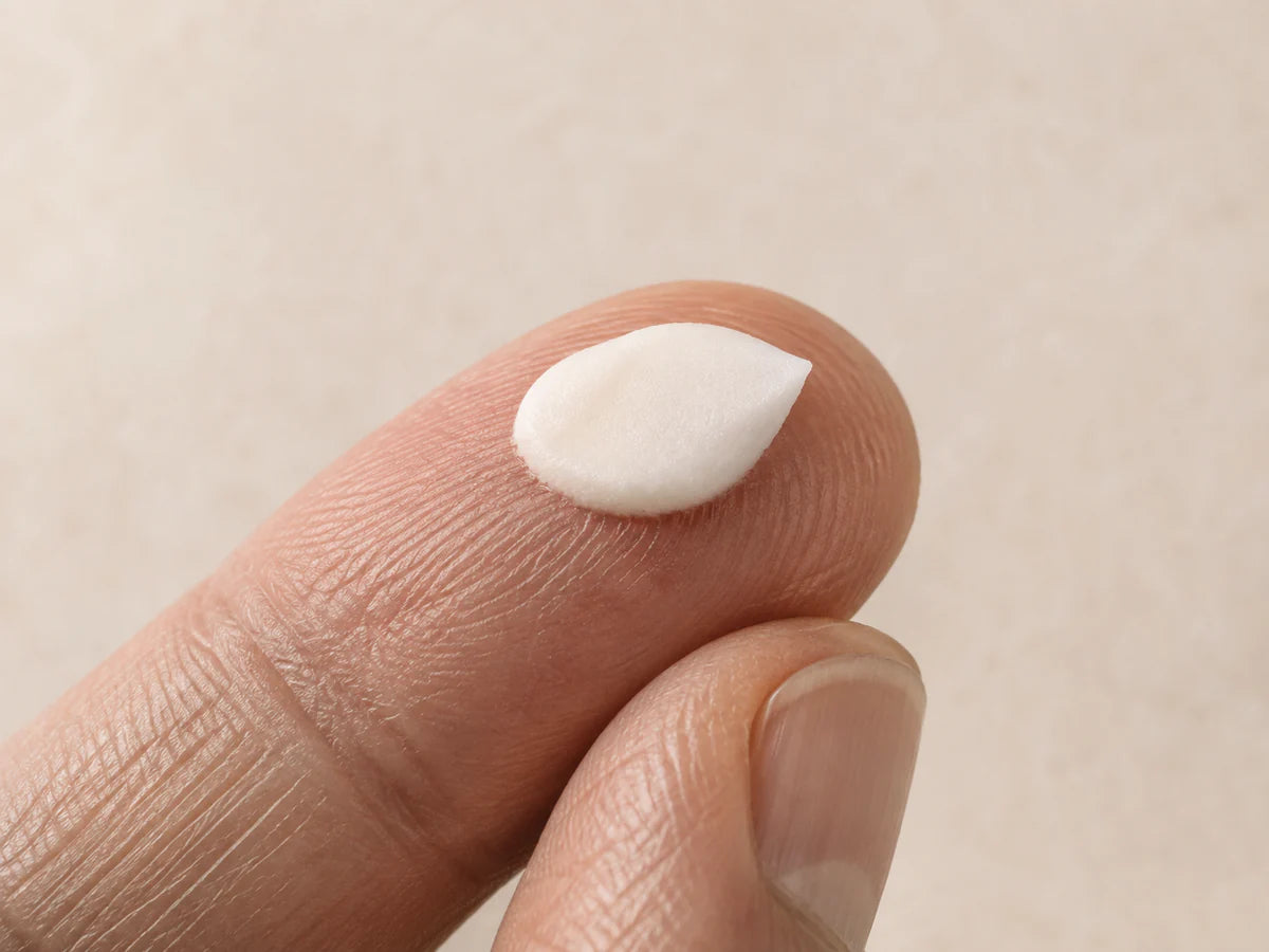 A small amount of cream on a fingertip