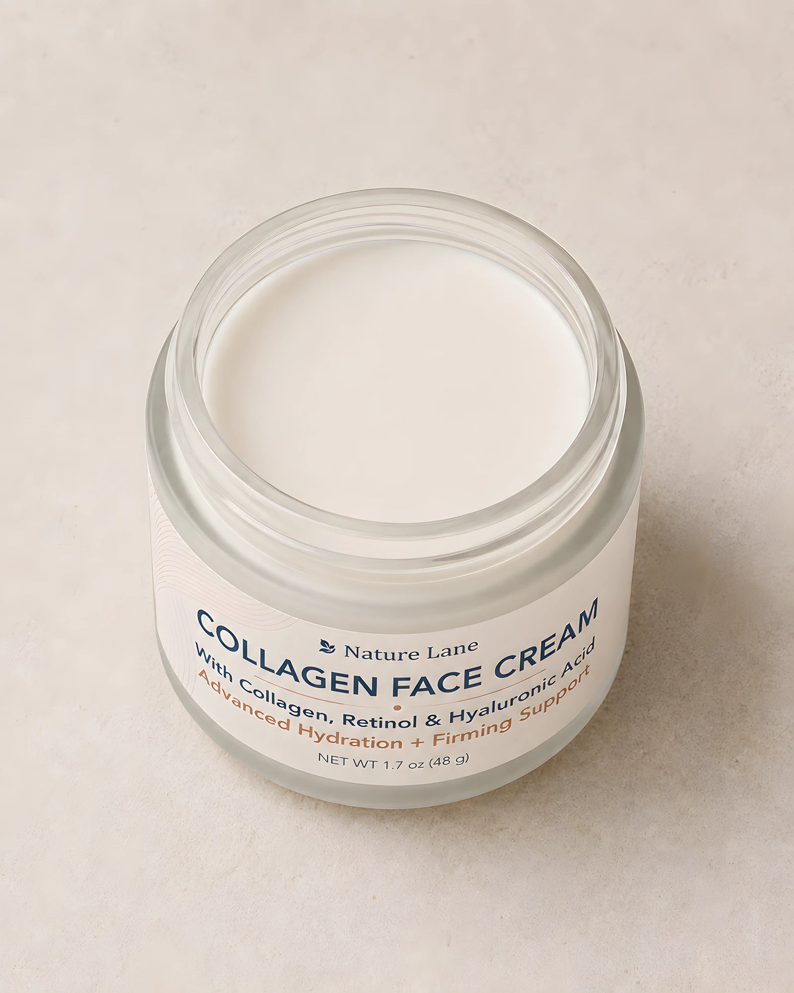 The open jar at a three-quarter angle, showing the matte off-white cream inside and the full front label.